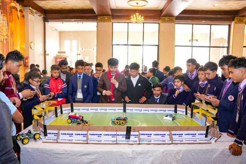 Students competing with robots